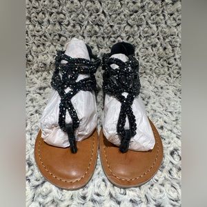 Justice. Brand New. Thong sandal. Black iridescent beaded body. Girls US 3